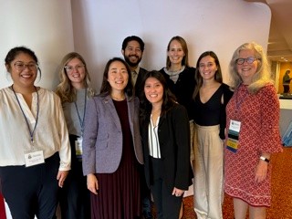 Participants at the 2023 AACO National Meeting standing in a group and smiling