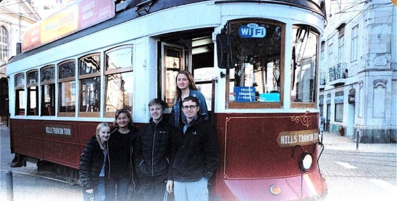 Caleb Nelson and family in front of a train