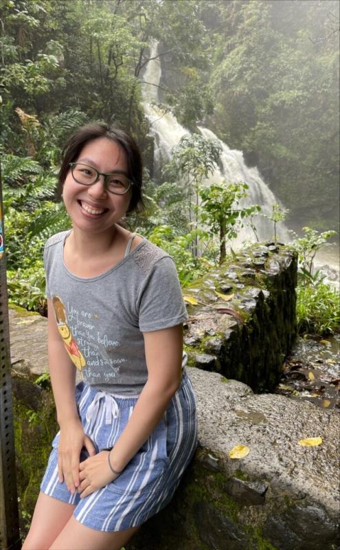 Elise Hon in front of a waterfall