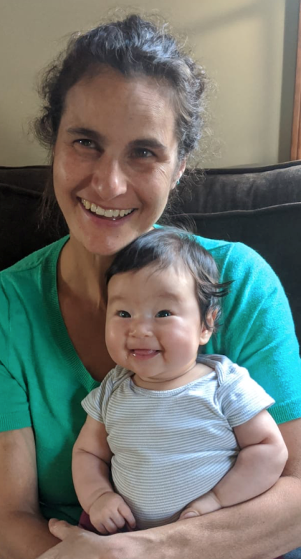 Emily Barsky holding a baby