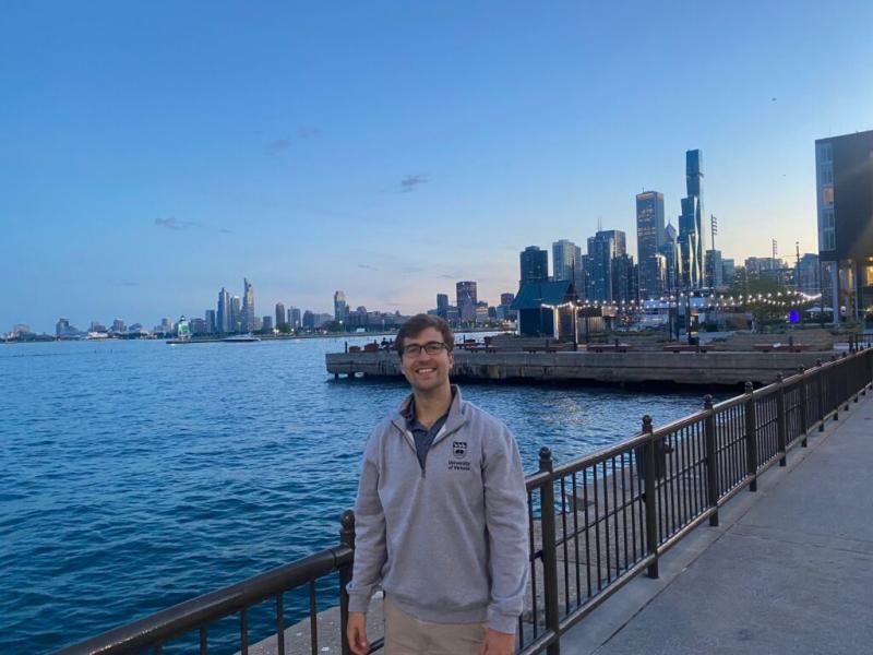 John Hammond on a sidewalk by the ocean