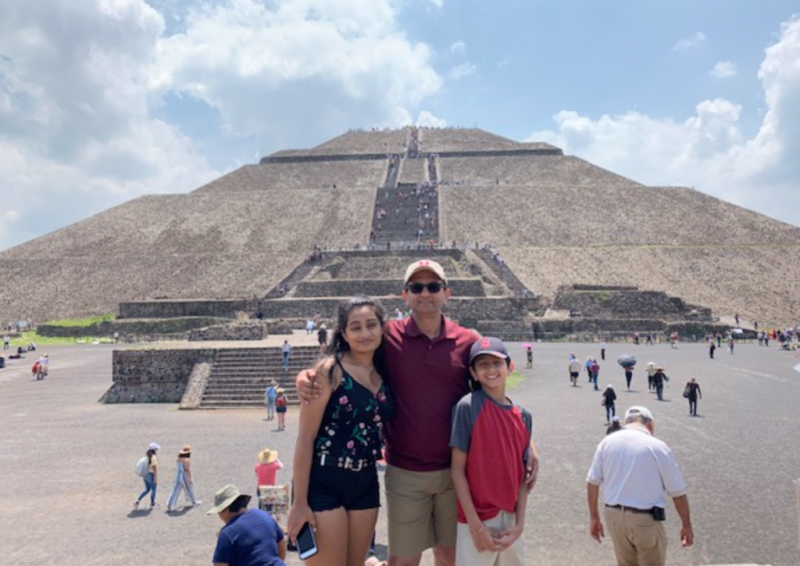 Umakanth Katwa and family in front of pyramid with stairs