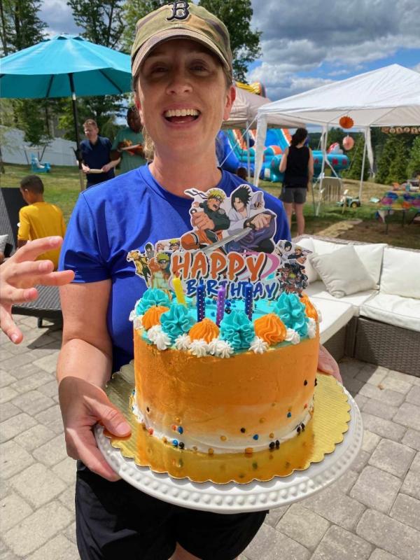 Vivian Williams holding a cake