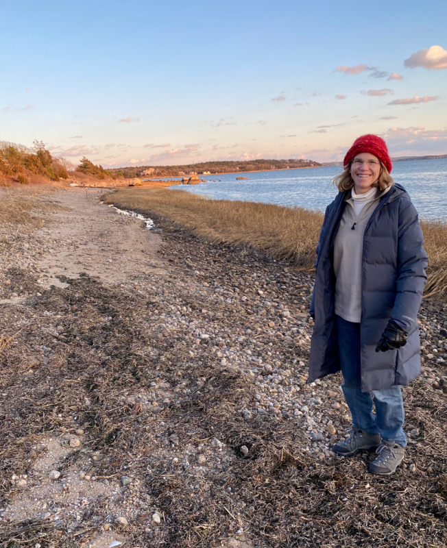 Martha Fishman on a coast at sunset